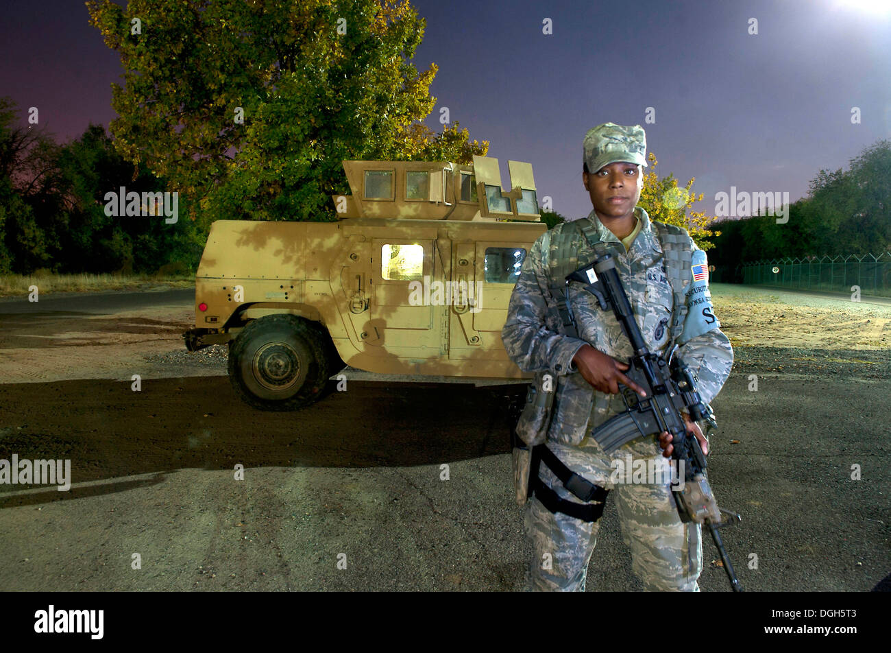 Airman 1st Class Keshia Robinson, 376th Expeditionary Security Forces Squadron response force member, stands next to an armored Stock Photo