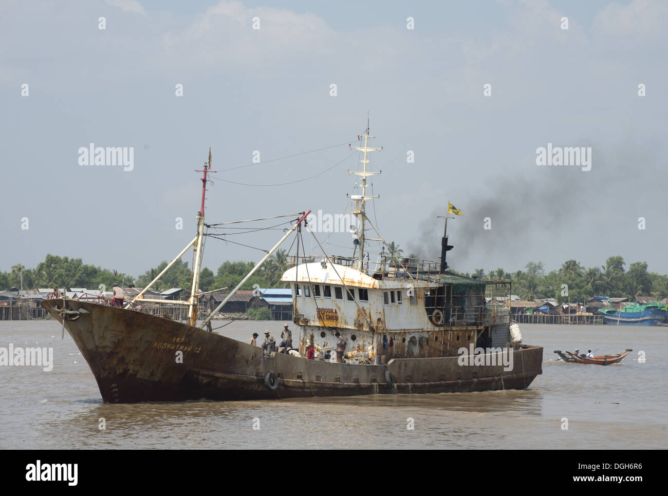 Dilapadated old ship on river, Yangon, Myanmar, March Stock Photo