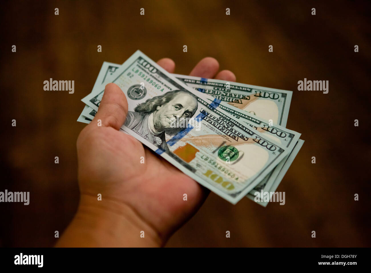new-100-dollar-bills-in-hand-stock-photo-alamy