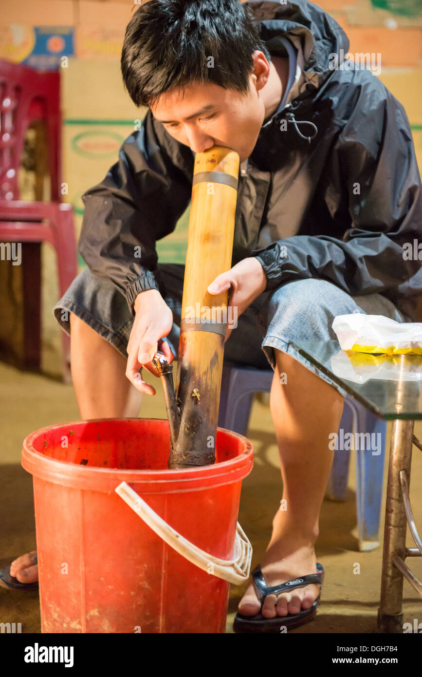Minority group flower Hmong man smoking with bamboo pipe, Bac Ha, Lao
