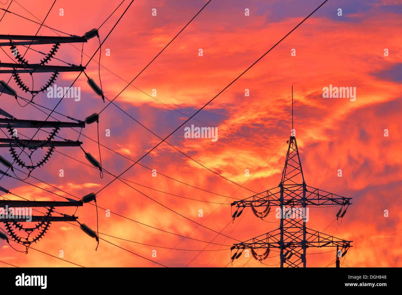 High Voltage Line over sunset background Stock Photo - Alamy