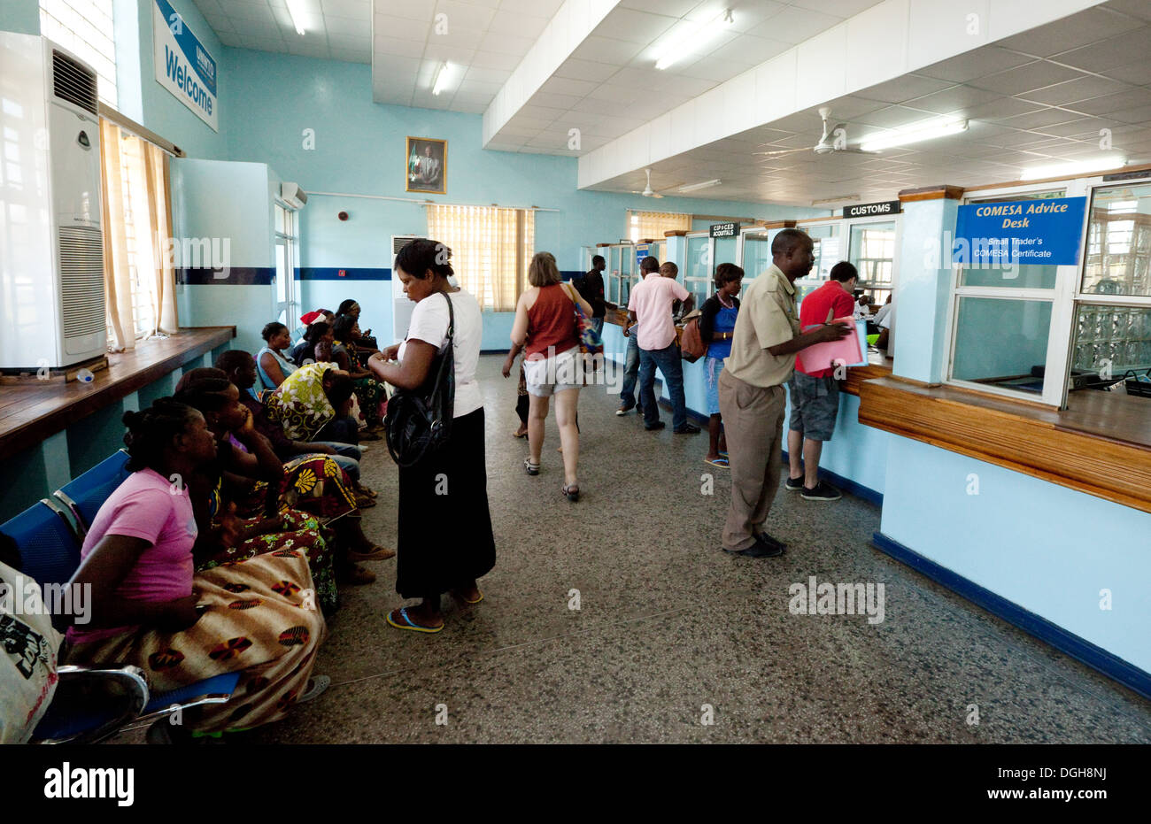 Border Crossing Africa; Local people, interior of the customs building, crossing the border between Zambia and Zimbabwe, Victoria Falls, Zambia Africa Stock Photo