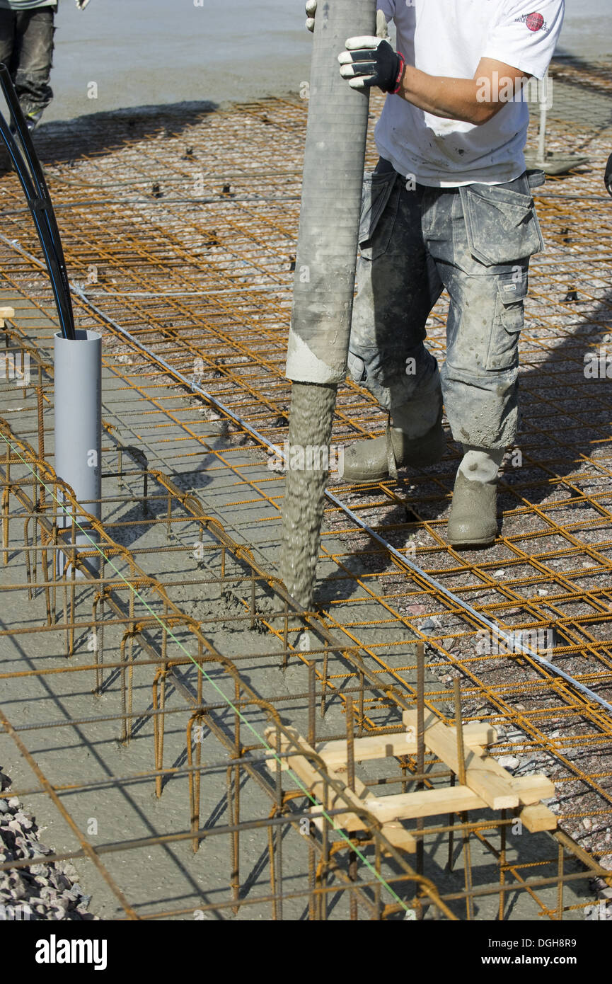 Construction work on farm building for loose housing, concrete being
