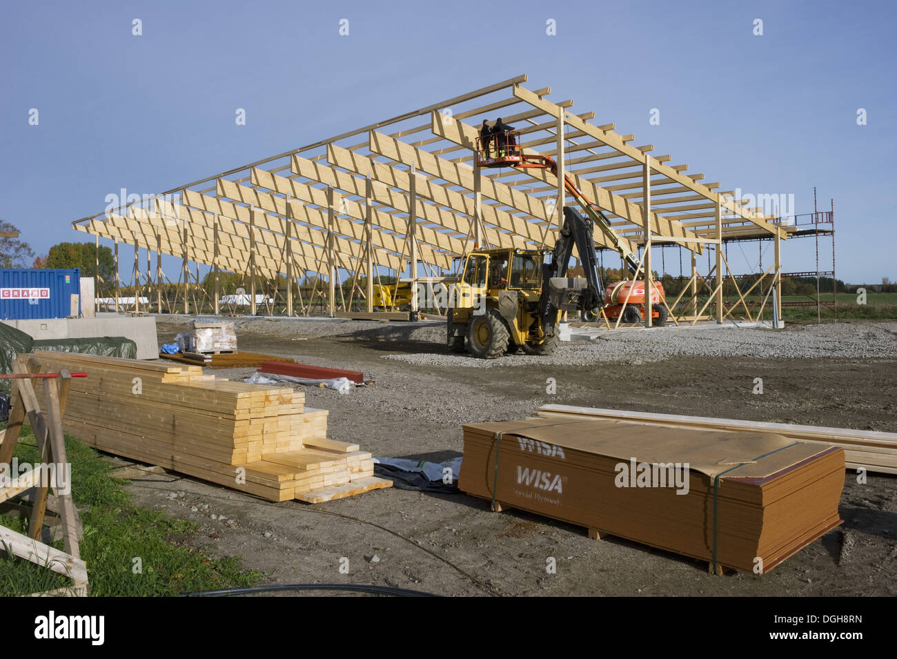 Construction work on farm building for loose housing, planks for wooden