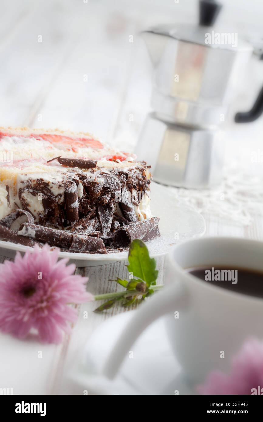 Strawberry stracciatella cake with chocolate curls on top Stock Photo