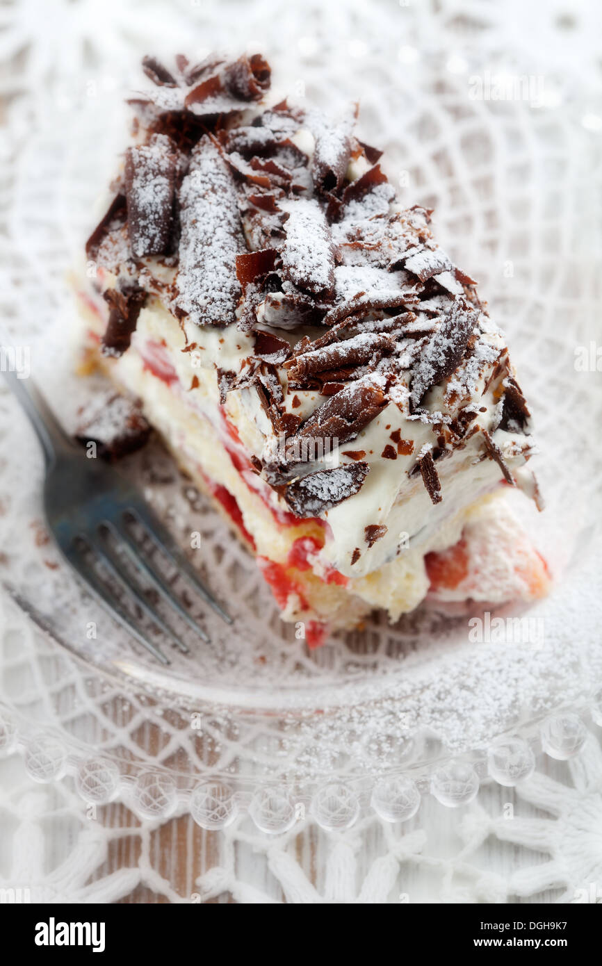 Strawberry stracciatella cake with chocolate curls on top Stock Photo