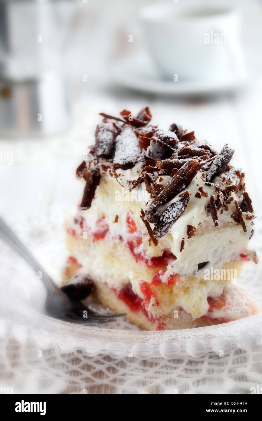Strawberry stracciatella cake with chocolate curls on top Stock Photo