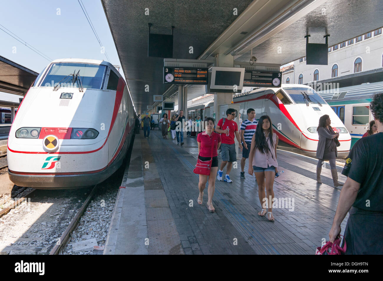 Trenitalia trains arrive at Venice rail station, passengers walking along platform,Venice Italy, Europe Stock Photo