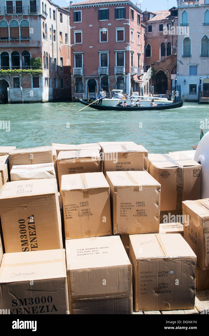 Delivery of cardboard boxes within a boat on the Grand Canal, Venice, Italy, Europe Stock Photo