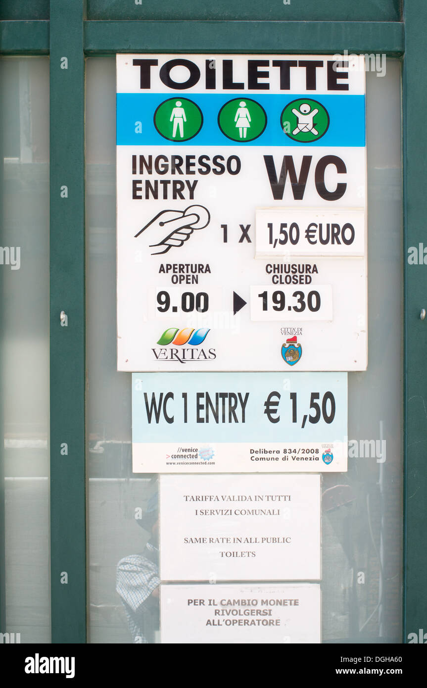 Sign outside expensive public toilet or WC in Venice, Italy, Europe 1.5 Euro to spend a penny Stock Photo