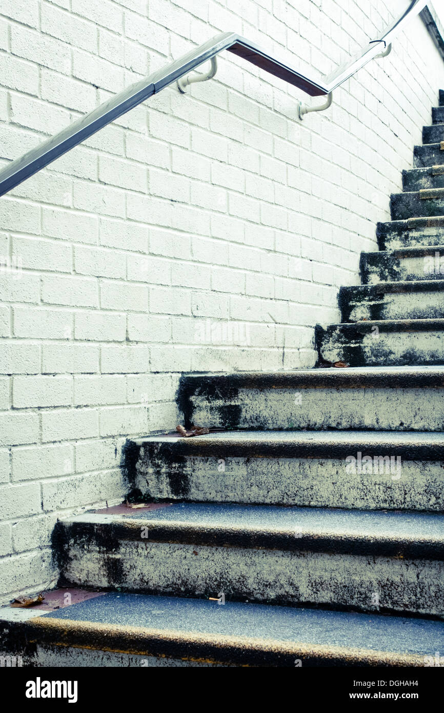 Stone steps and white wall in muted tones Stock Photo