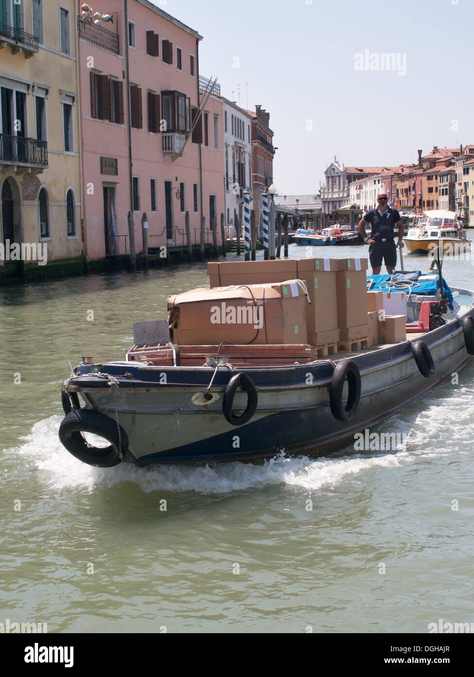 Workboat delivering supplies on the grand Canal Venice, Italy, Europe Stock Photo