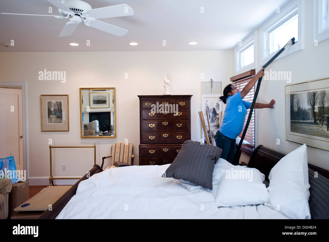 Employees of the New York's Little Elves cleaning company and a window