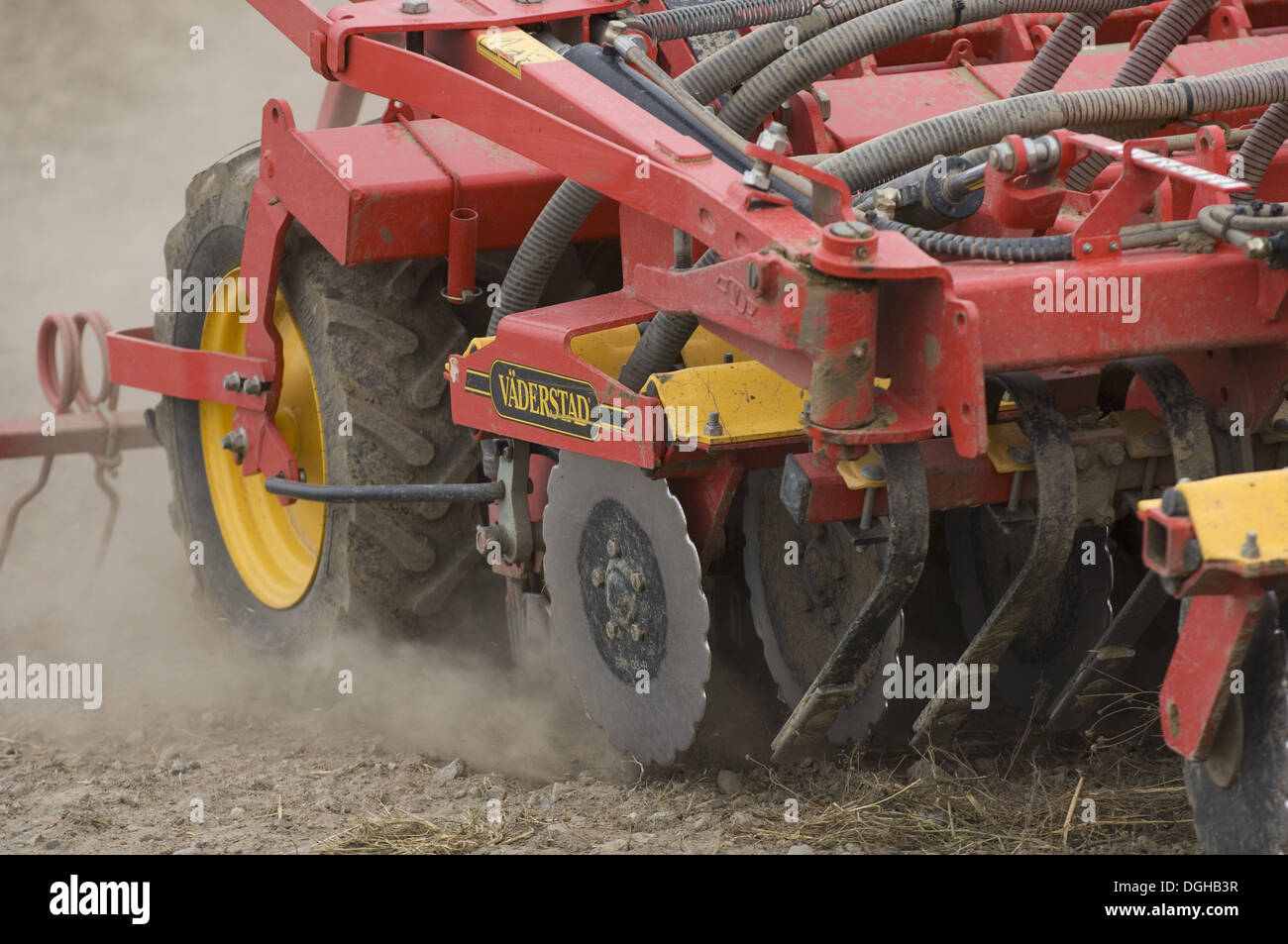 Close-up of Vaderstad seed drill, drilling wheat crop, Sweden, autumn Stock Photo