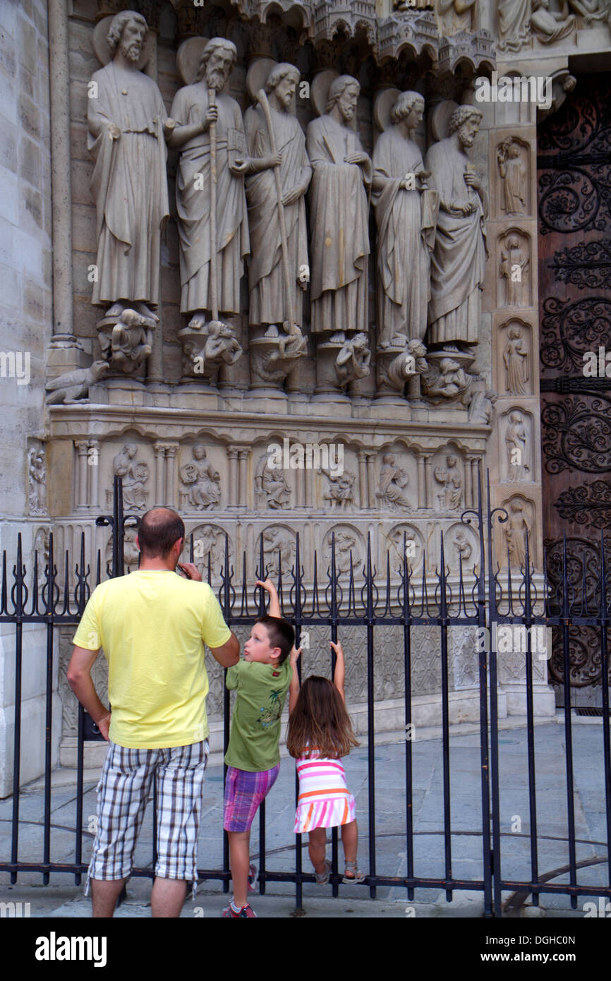 Paris France,4th arrondissement,Île de la Cité,Place Jean-Paul II,Notre Dame Cathedral,exterior,man men male,father,boy boys male kids children son,gi Stock Photo