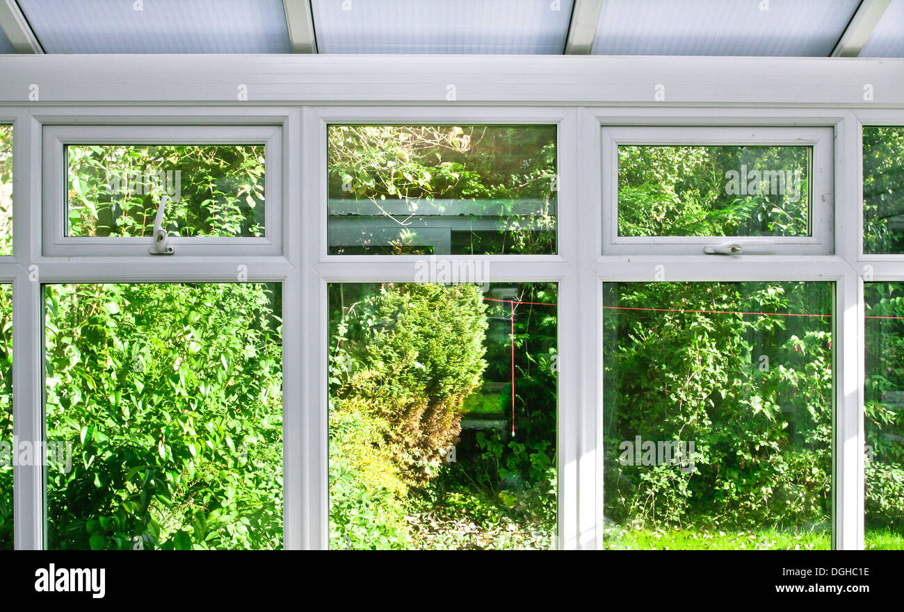 Modern home conservatory windows with garden view Stock Photo - Alamy