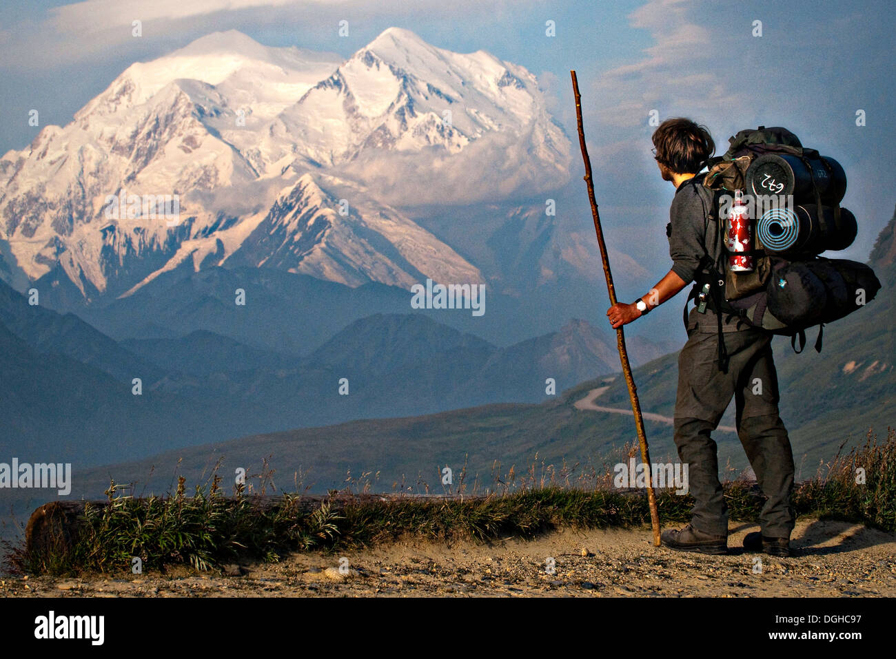 A hiker pauses to view Mt McKinley in Denali National Park, Alaska Stock Photo