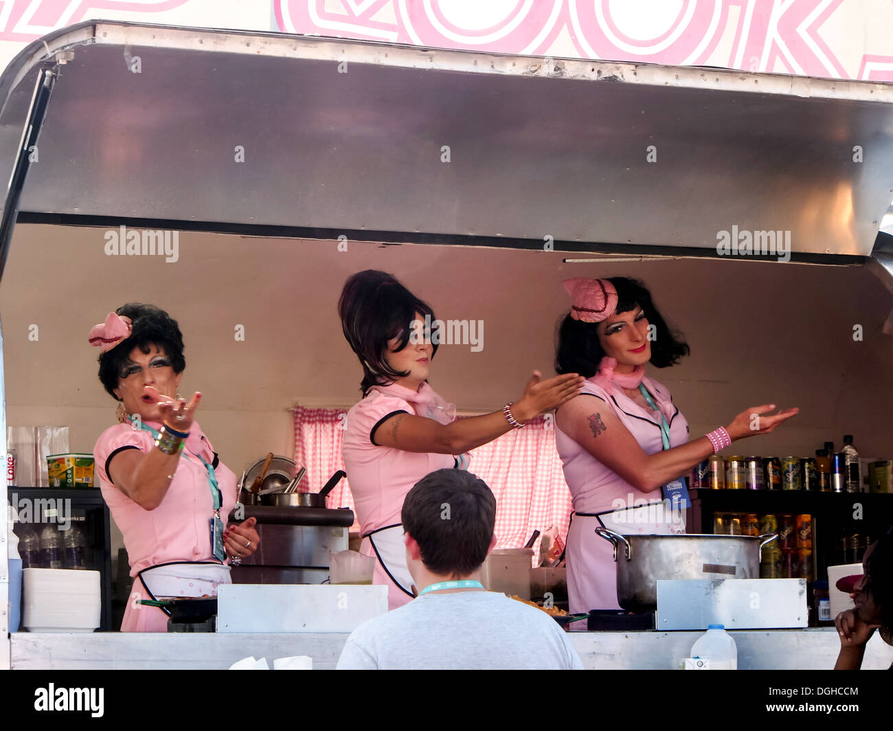 The Camp Cooks catering team performing within their mobile kitchen that tours major events throughout the UK. Stock Photo