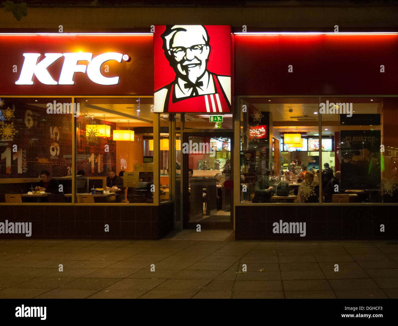 The exterior of a KFC fast food restaurant at night Stock Photo