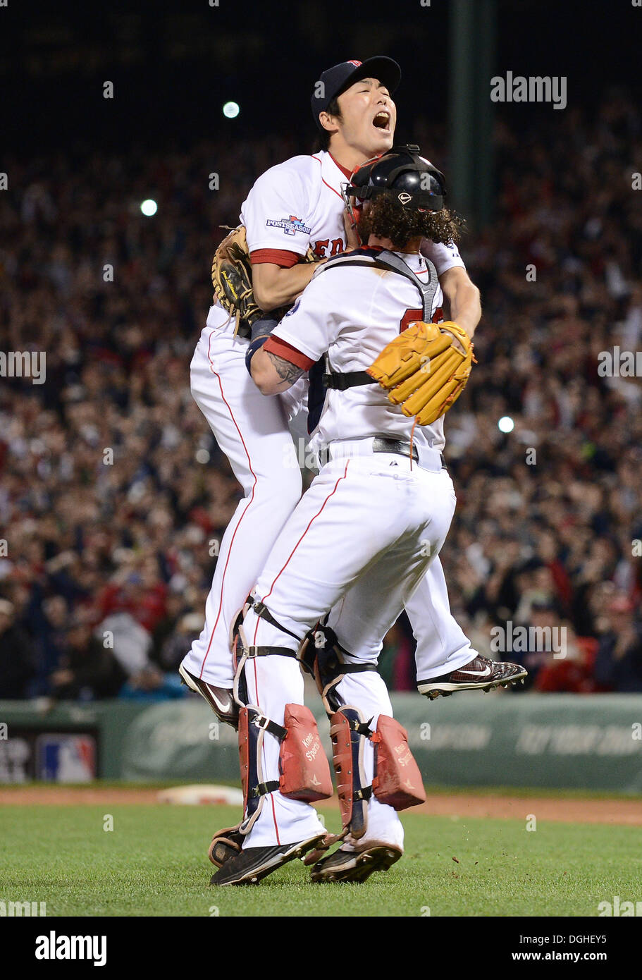 Boston Red Sox catcher David Ross (L-R) relief pitcher Koji Uehara and the  rest of the team celebrate after the final out of Game 6 of the World Series  against the St.