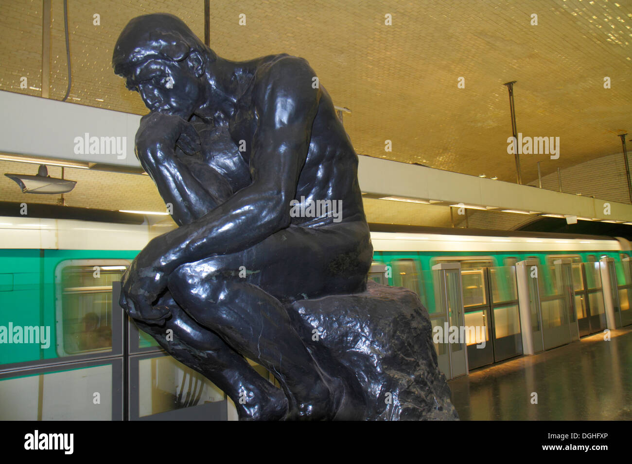 Paris France,7th arrondissement,Varenne Metro Station Line 13,subway,train,platform,Rodin,The Thinker,train,art,sculpture,France130818045 Stock Photo