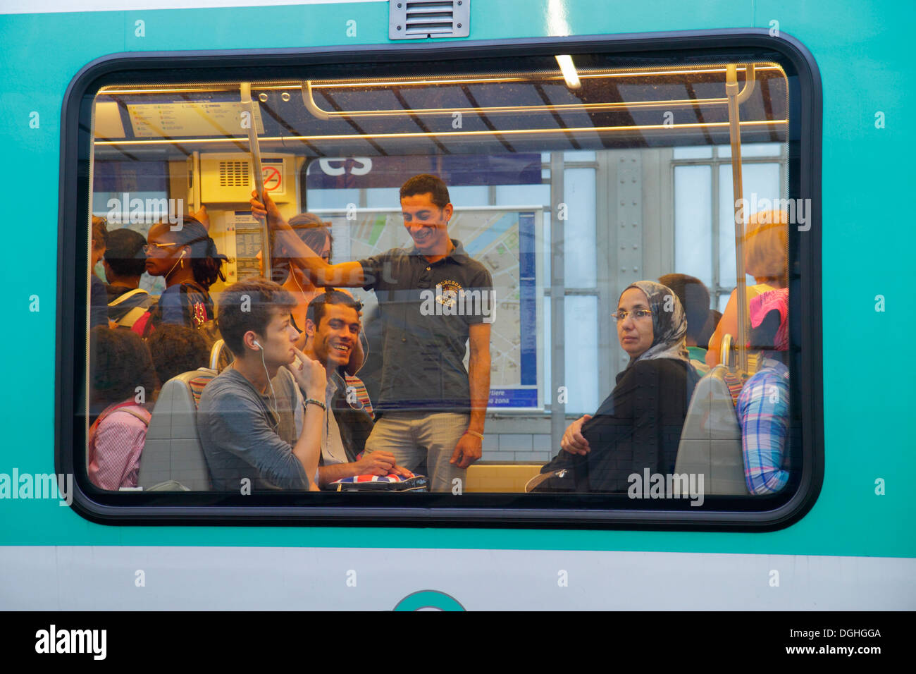 Paris France,10th 19th arrondissement,Jaures Metro Station Line 2 5 7,subway,train,riders,passenger passengers rider riders,train car cabin window,sta Stock Photo