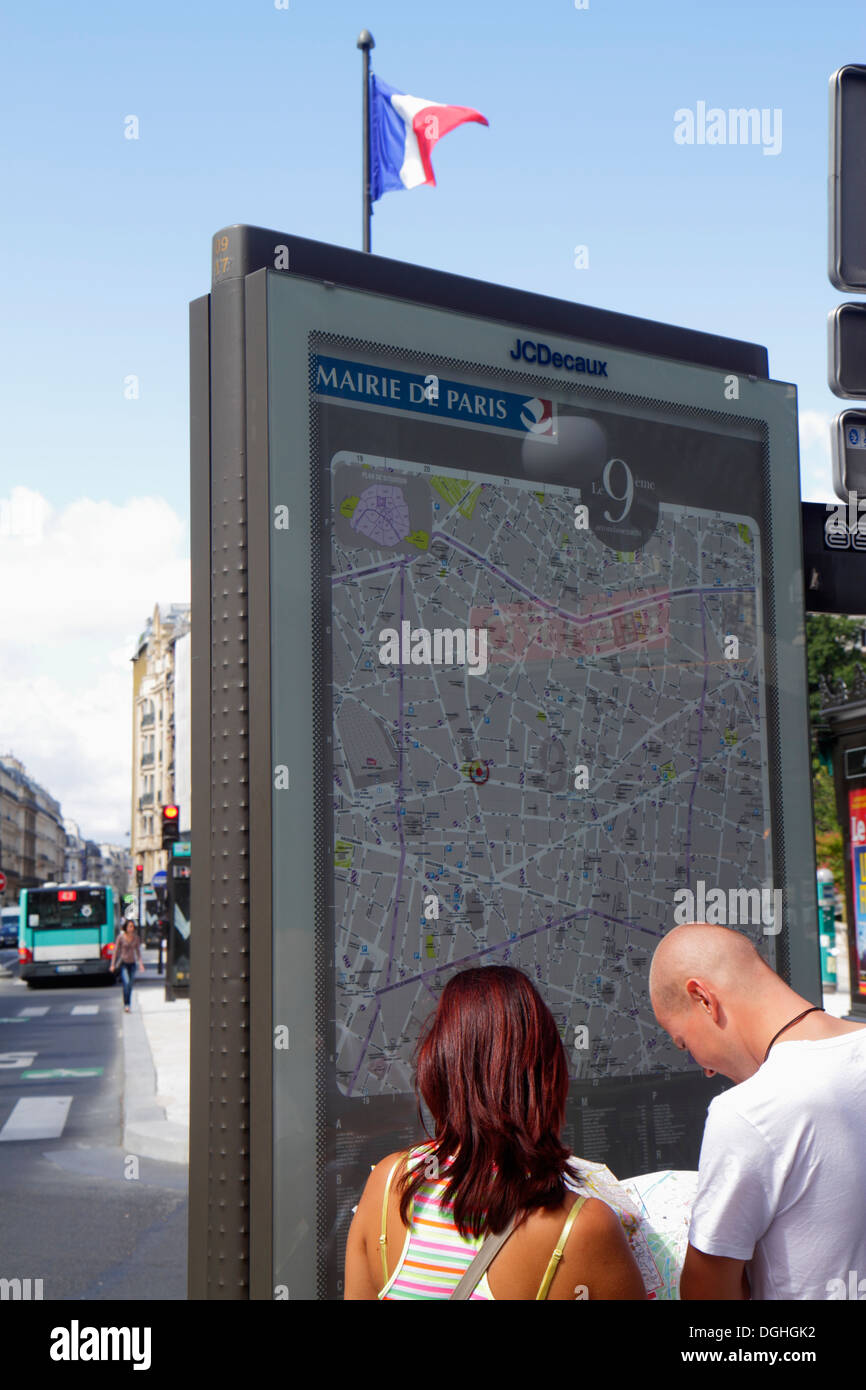 Paris France,9th arrondissement,Place d'Estienne d'Orves,street map,man men male,adult,adults,woman female women,couple,looking at,France130819008 Stock Photo