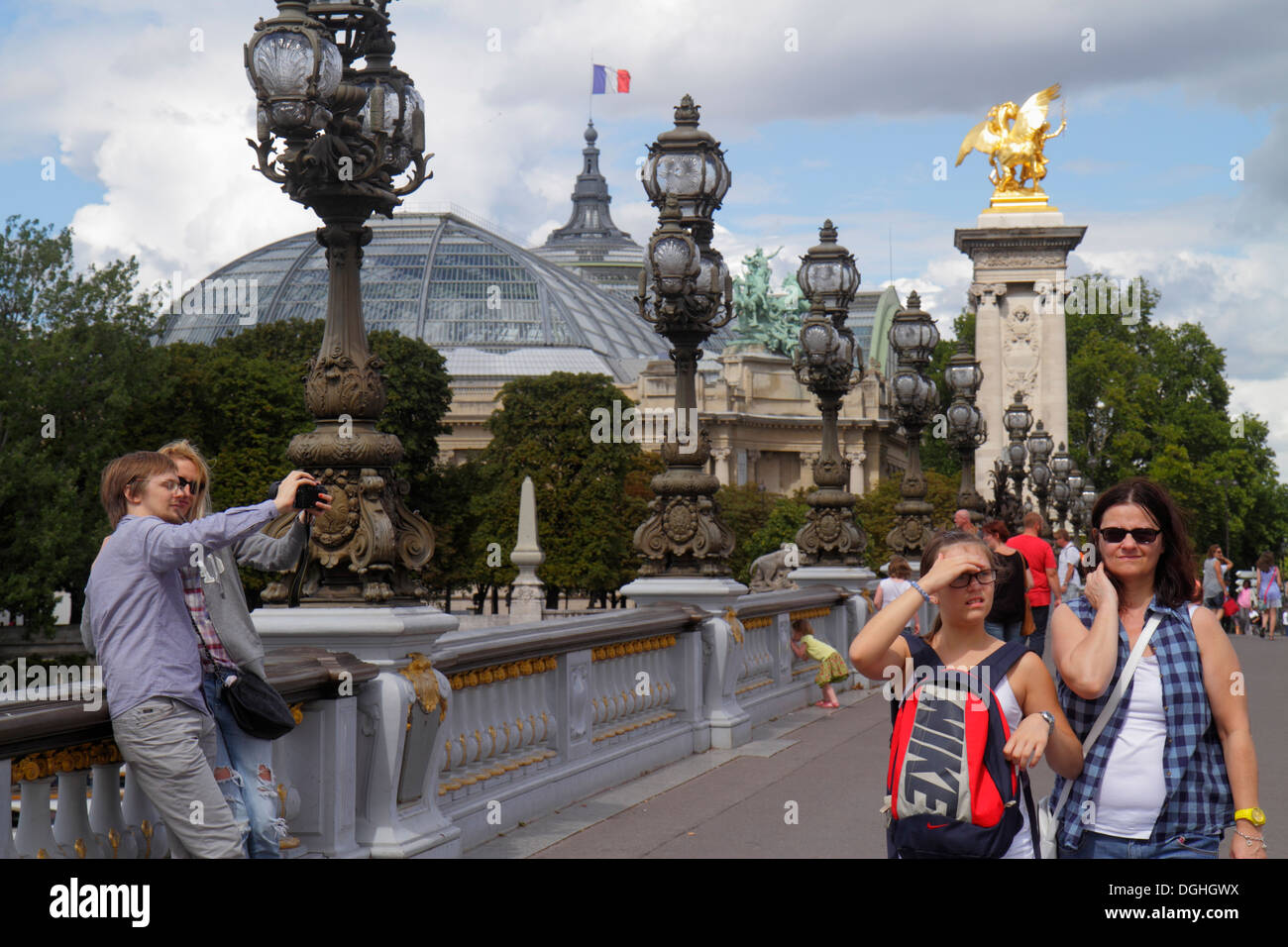 Paris France,Europe,French,Seine River water,Pont Alexandre III,bridge,Art Nouveau lamps,gilded statue,galeries nationales du Grand Palais,Grand Palai Stock Photo