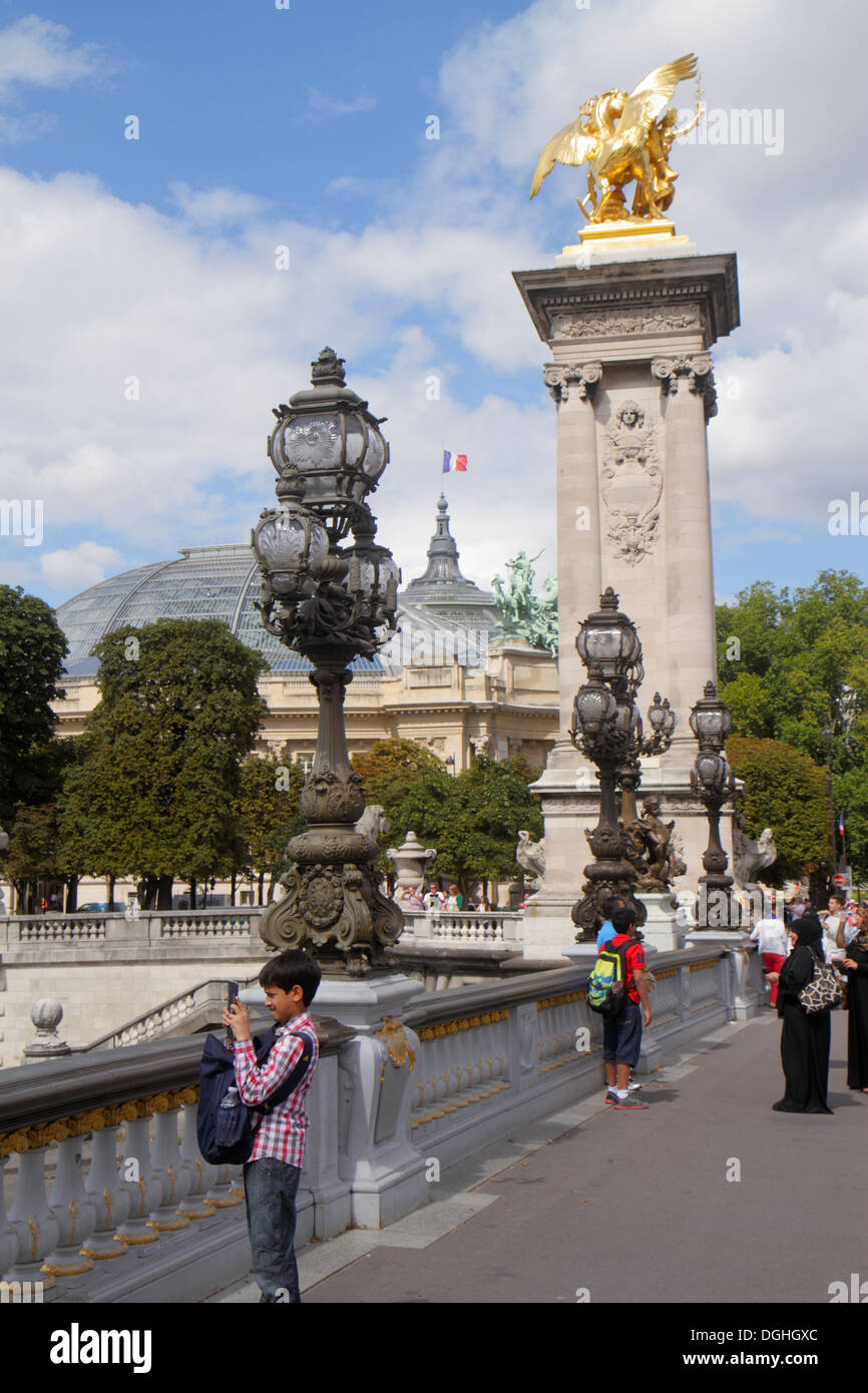 Paris France,Seine River,Pont Alexandre III,bridge,Art Nouveau lamps,gilded statue,galeries nationales du Grand Palais,Grand Palais National Galleries Stock Photo