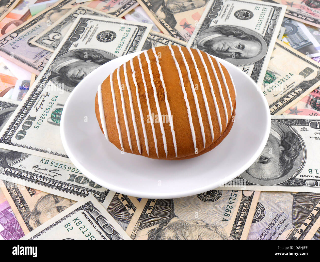 cake on money dollars background Stock Photo