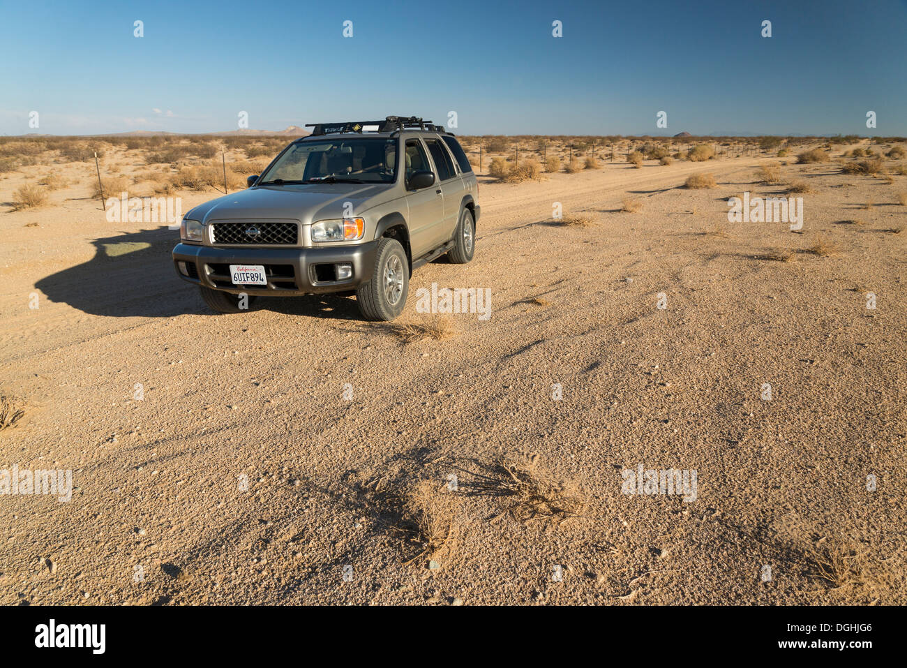 Offroad SUV on a desert backroad, near California City. Stock Photo