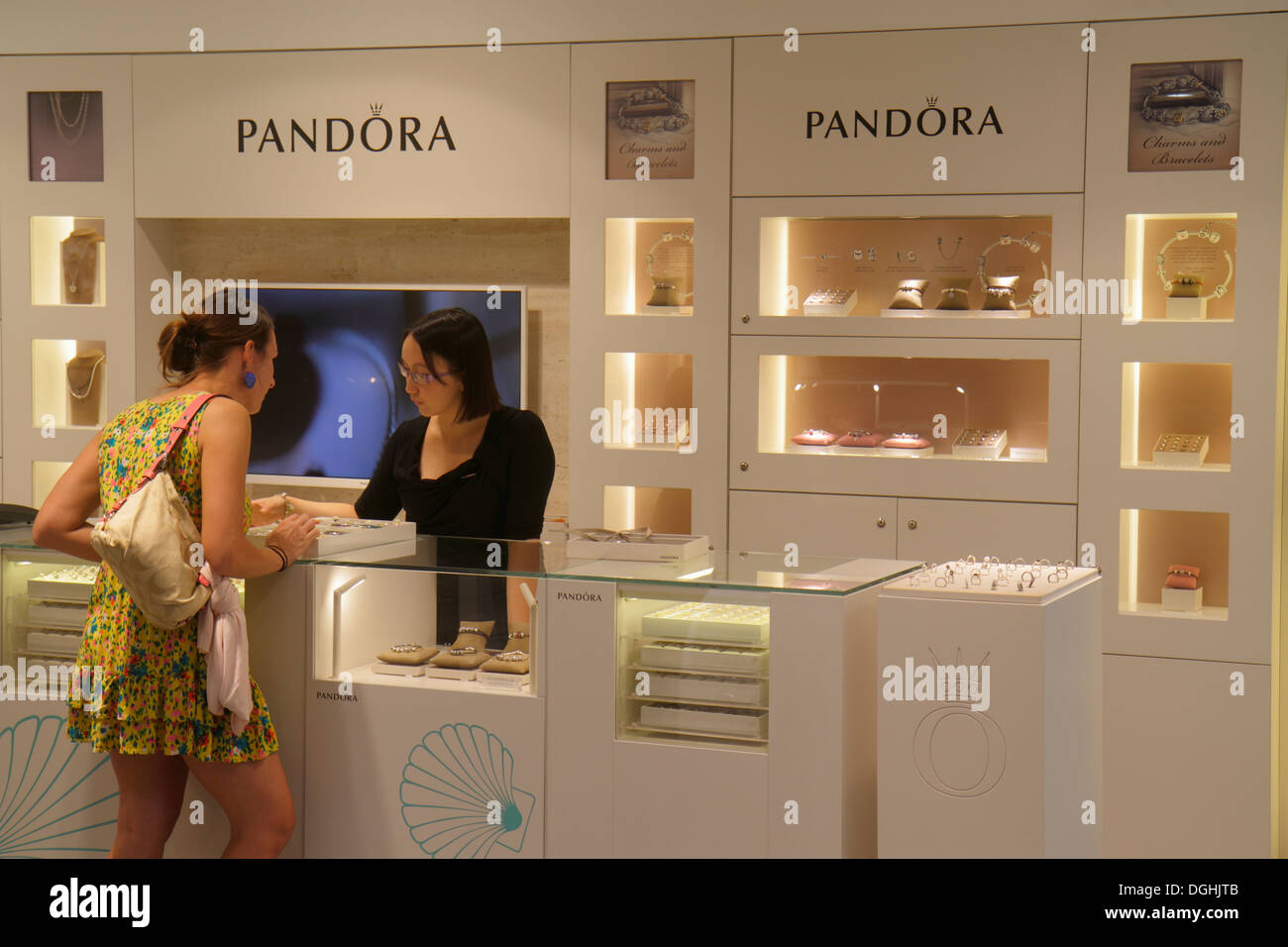 Paris France,1st arrondissement,Carrousel Carousel du Louvre underground mall,Pandora,jewelry,jewellery,Asian adult,adults,woman female women,counter, Stock Photo