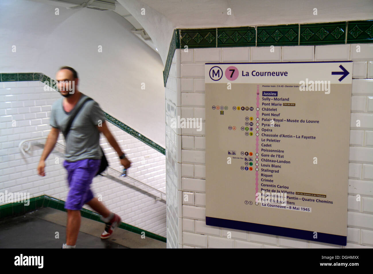Paris France,5th arrondissement,Jussieu Metro Station Line 7,subway,train,rider,passenger passengers rider riders,man men male,sign,directions,station Stock Photo