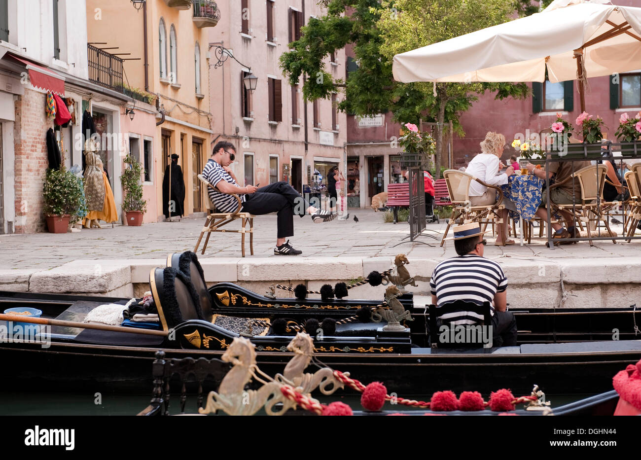 Gondoliers waiting for customers, Venice, Veneto, Italy, Europe Stock Photo