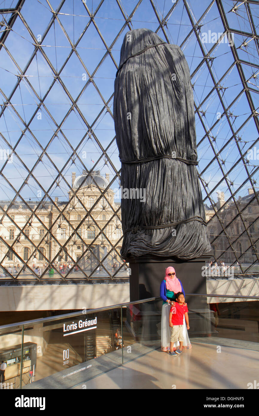 Paris France,1st arrondissement,Louvre Art Museum,Musee du Louvre Palace,interior inside,Pyramid,sculpture,Muslim,adult,adults,woman female women,moth Stock Photo
