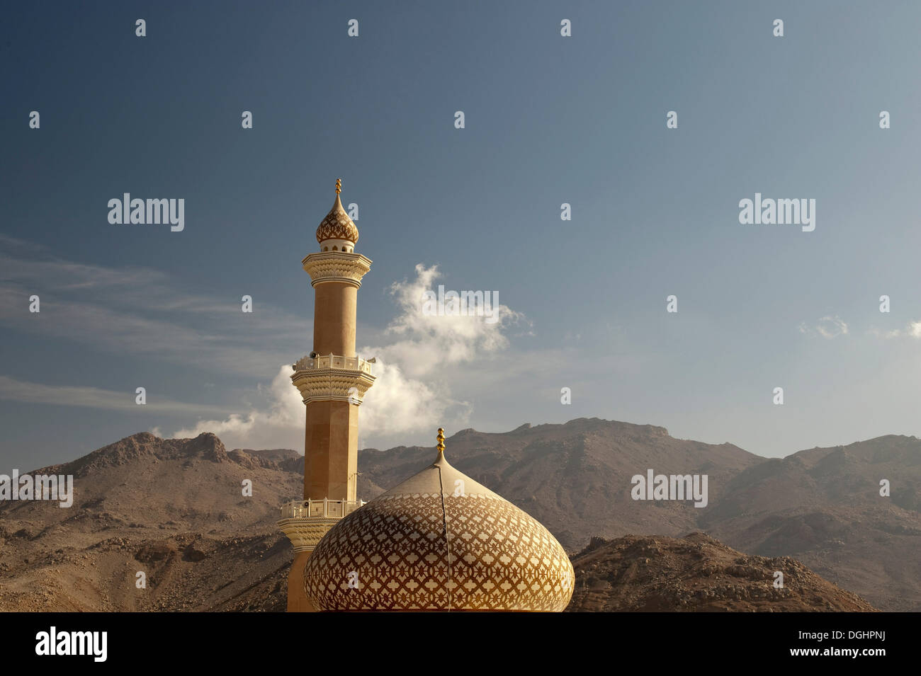 Sultan Quaboos Mosque with mountains and cloud at back, Nizwa, Oman, Middle East Stock Photo