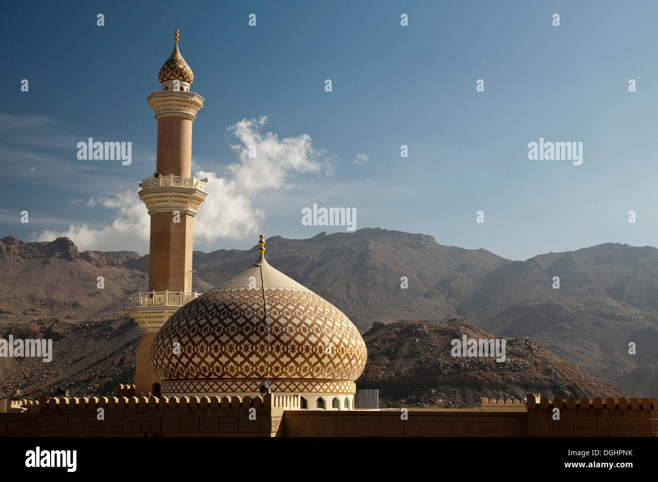 Sultan Quaboos Mosque with mountains and cloud at back, Nizwa, Oman, Middle East Stock Photo