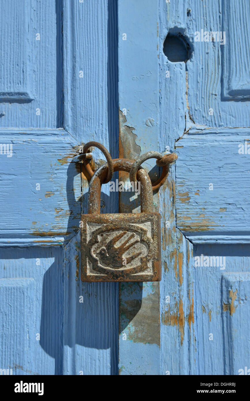Door handle with a dove on a bright blue door, Karterádos, Santorini