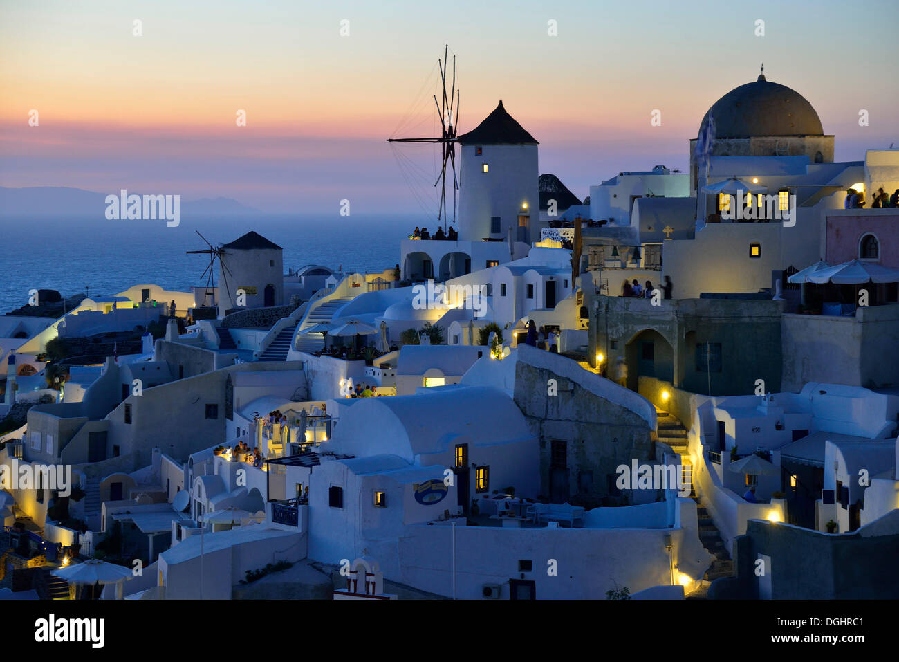 Windmill, Oía at dusk, Santorini, Cyclades, Greek island, Greece, Europe Stock Photo