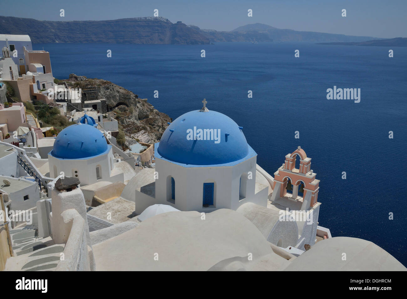 View from the rim across the rooftops of Oía into the Caldera, Santorini, Cyclades, Greek Islands, Greece, Europe Stock Photo