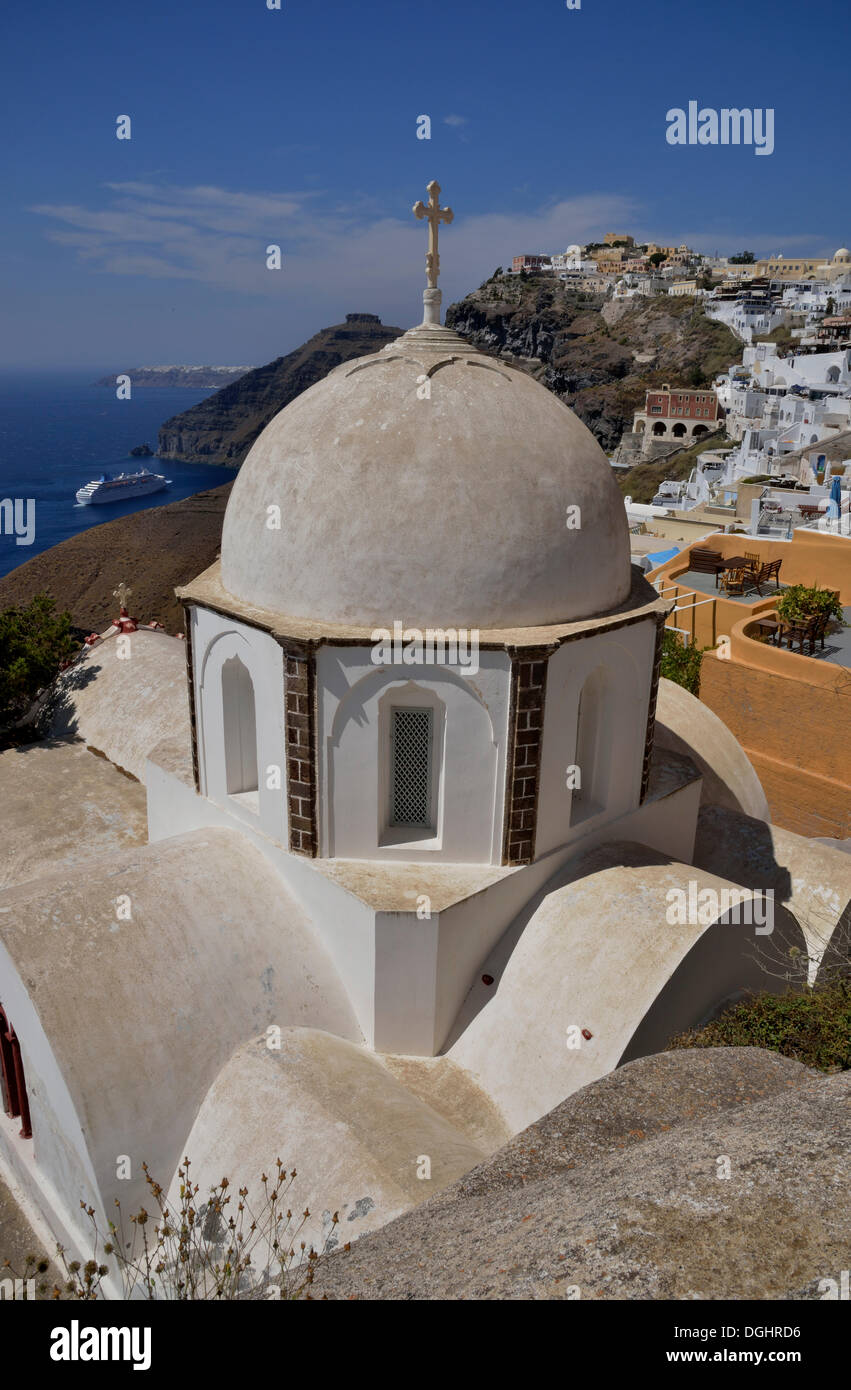 View from the rim across the rooftops of Firá or Thira into the Caldera, Ágios Ioánnis church at front, Santorini, Cyclades Stock Photo
