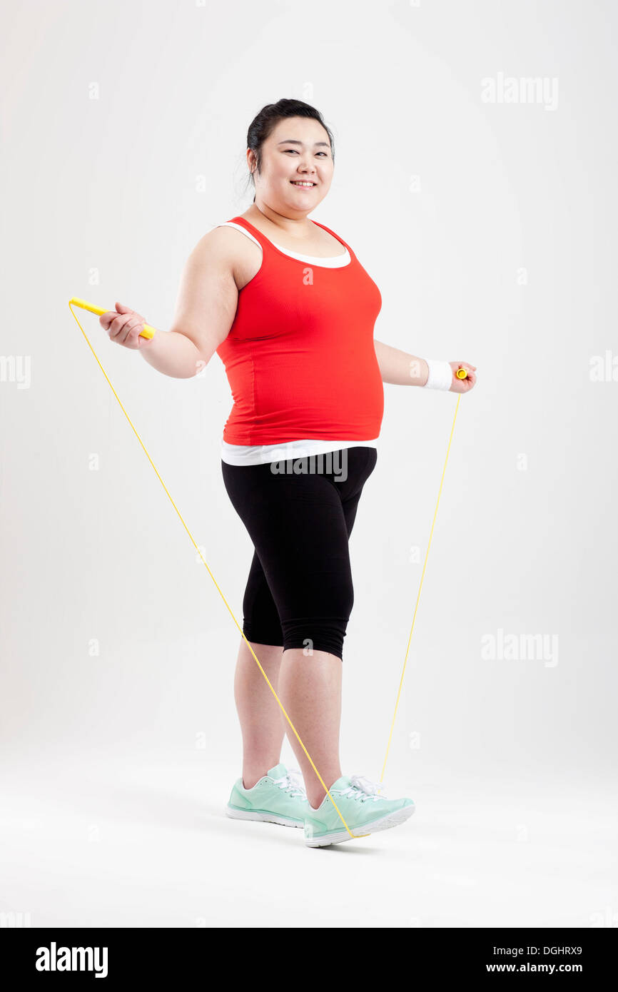 a fat girl stretching in a gym outfit Stock Photo - Alamy