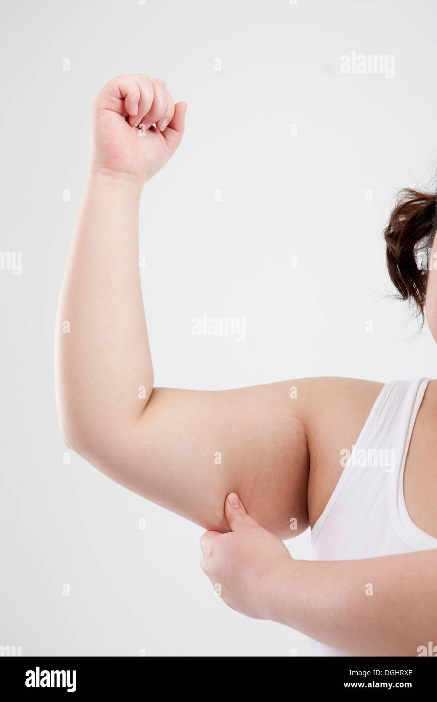 a fat girl showing her fat in the arm Stock Photo Alamy