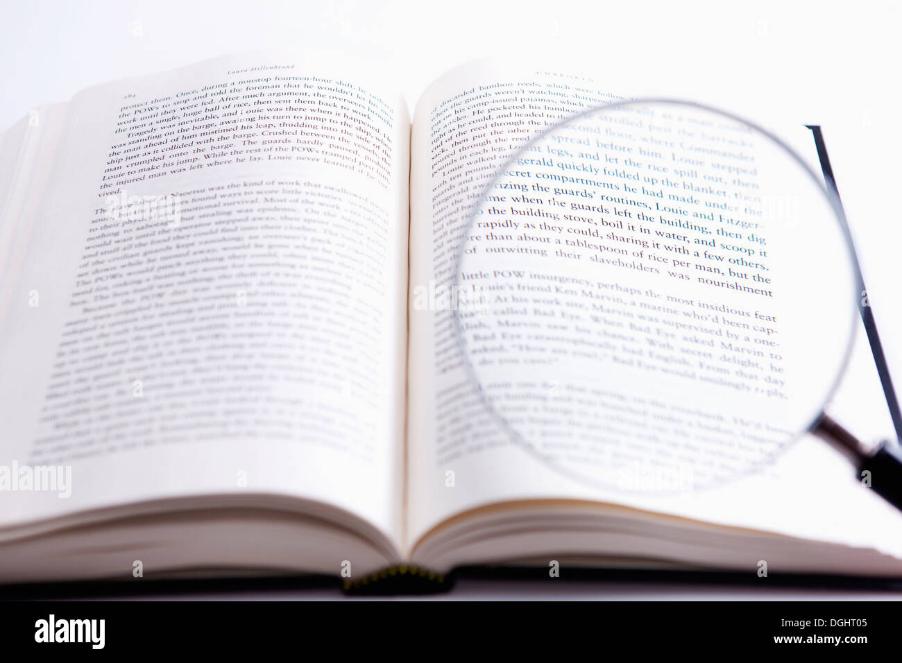 a book under a magnifying glass Stock Photo