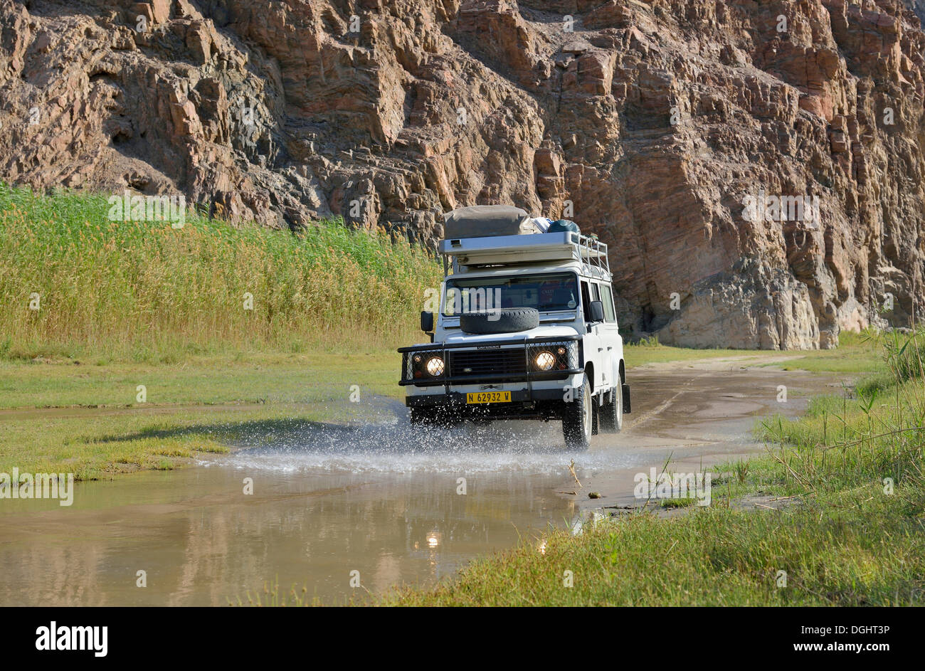 Safari vehicle in the Hoarusib river valley, Purros, Kaokoland, Kunene, Namibia Stock Photo