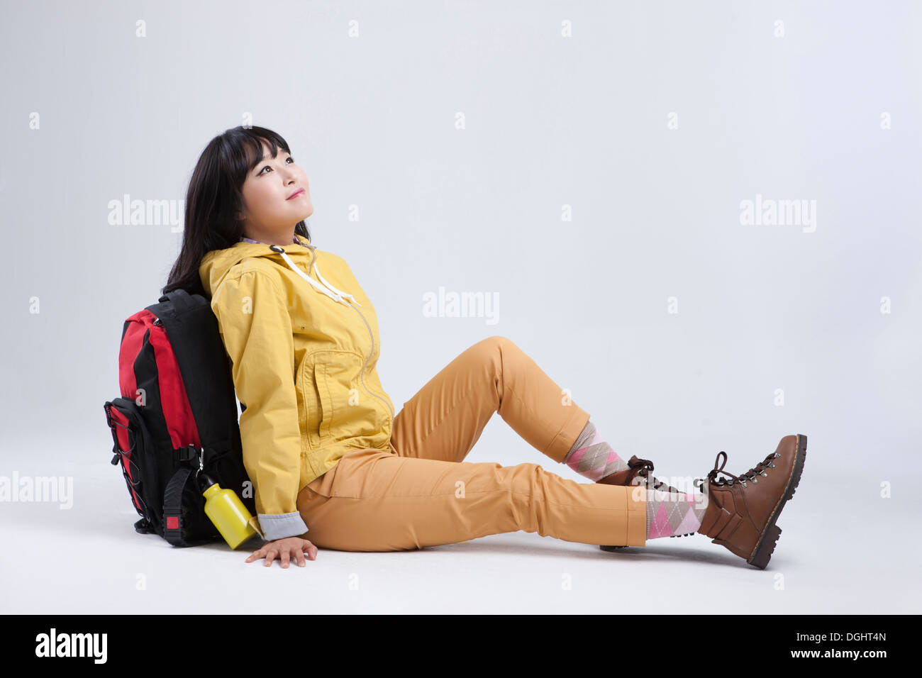 Woman sitting on the ground hi-res stock photography and images - Alamy