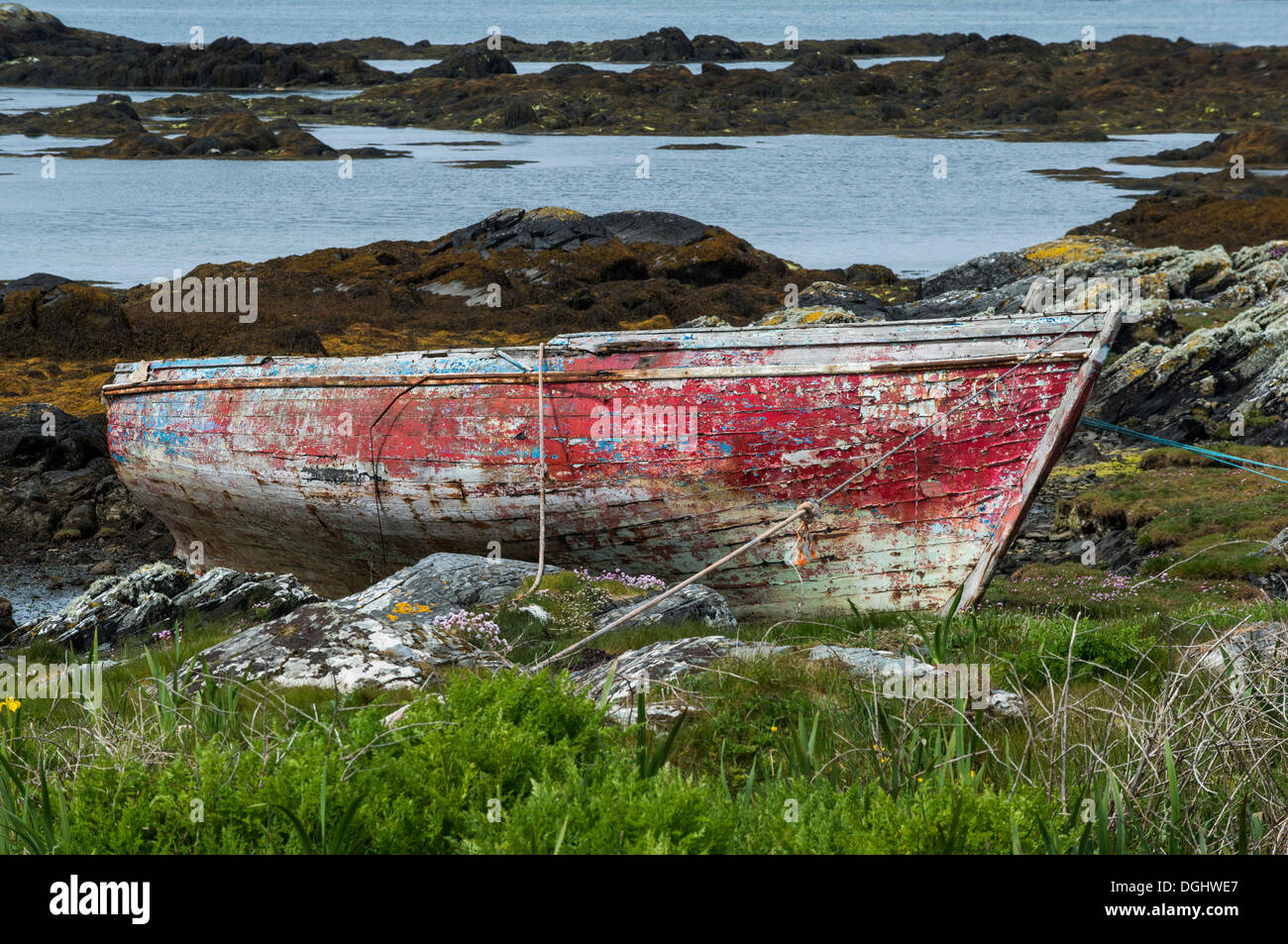 Old red wooden boat on the shore, Connemara, Ireland, Europe Stock Photo