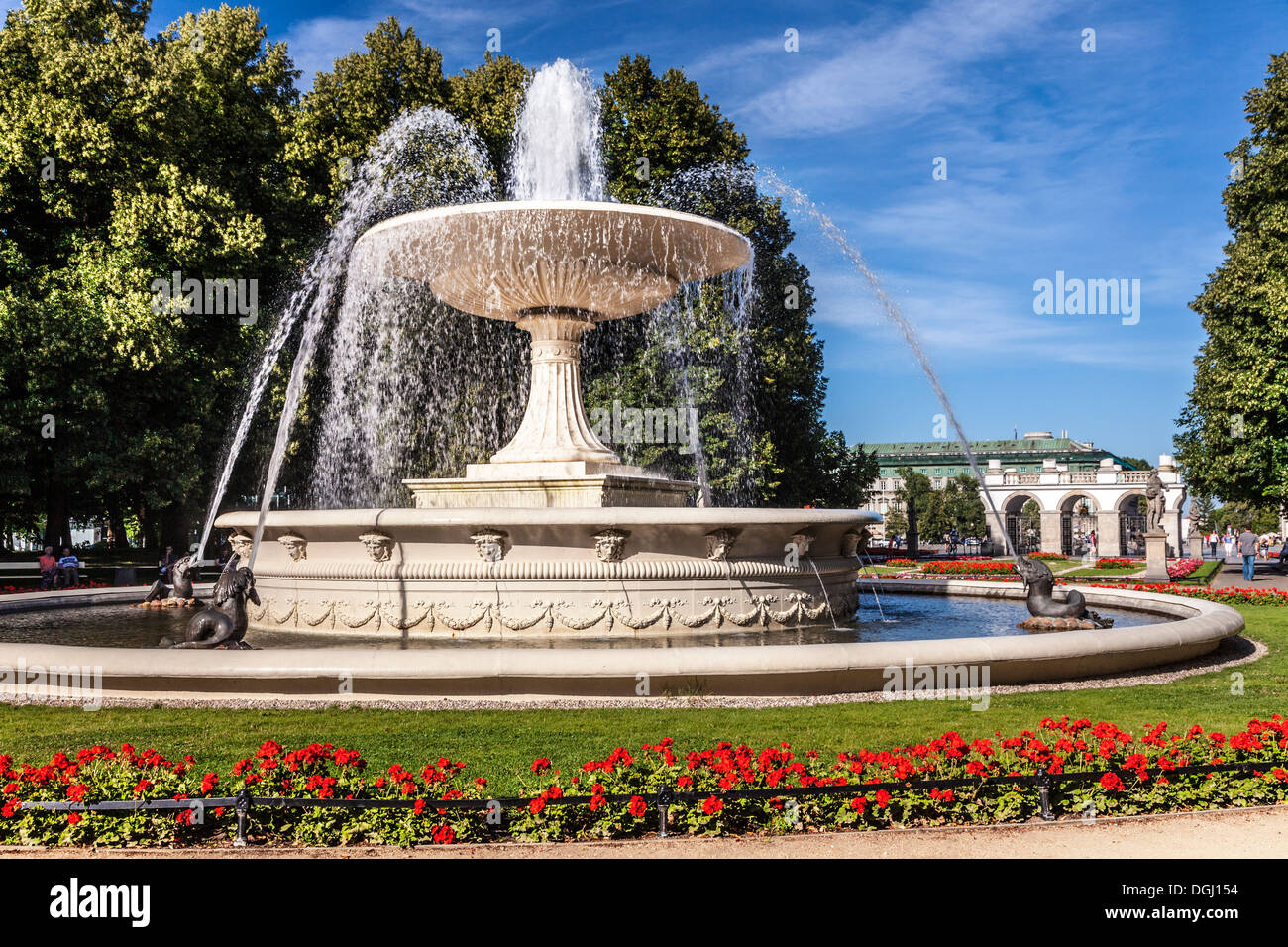 Fountain in Ogrod Saski in Warsaw with the Tomb of the Unknown Soldier in Pilsudski Square beyond. Stock Photo