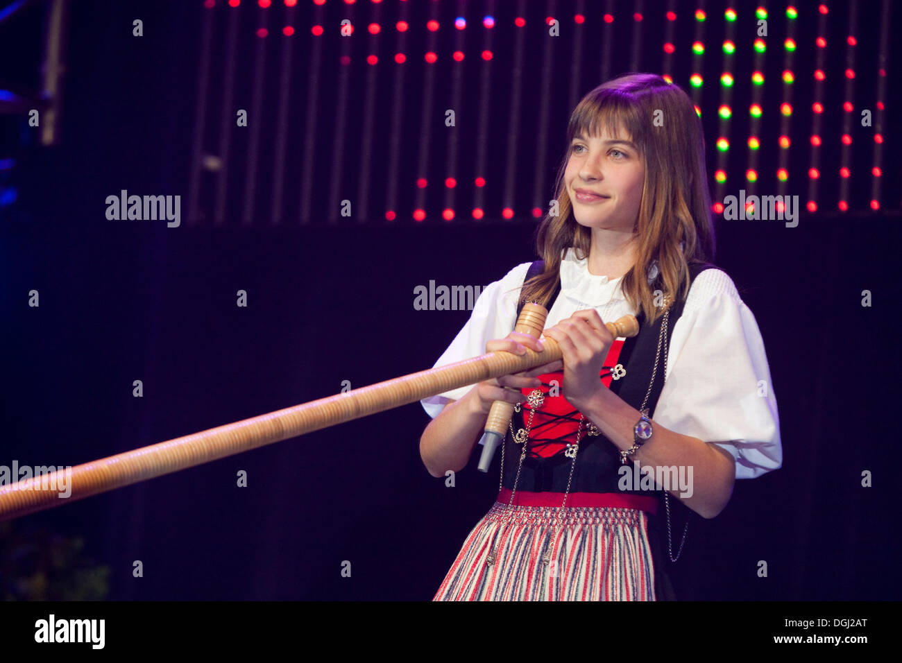 Young Swiss alphorn blower Lisa Stoll, winner of Stadelsterns 2009,  performing live at the 10th Schlager-Night in the new Stock Photo - Alamy