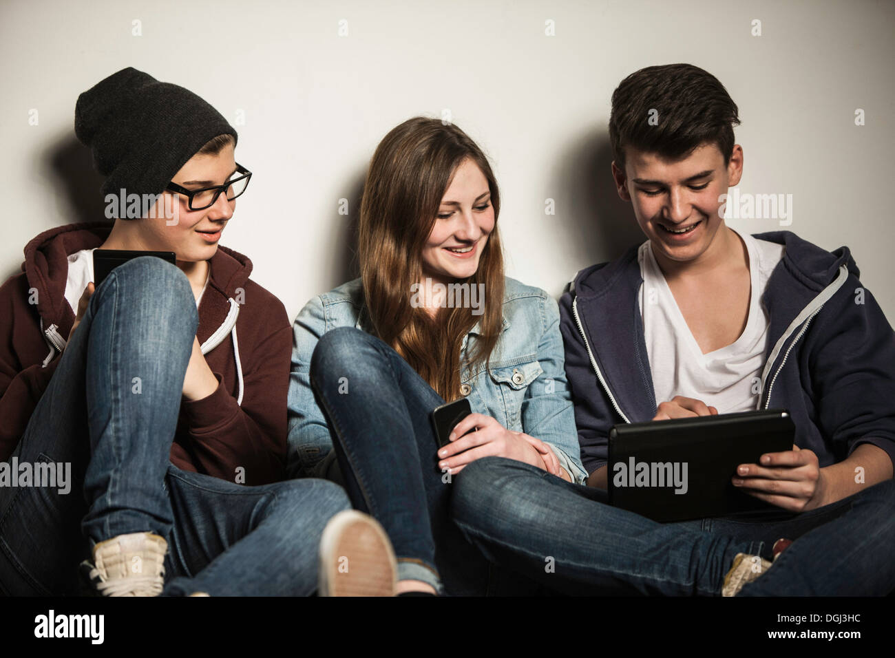 Teenagers using digital tablet Stock Photo